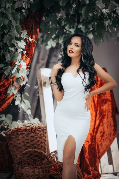 Young woman posing in white dress — Stock Photo, Image