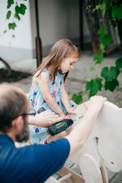 Cute Little Happy Girl Wooden Horse Her Grandfather — Stock Photo, Image