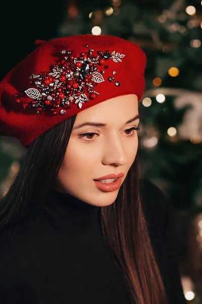 Beautiful woman posing in winter beret