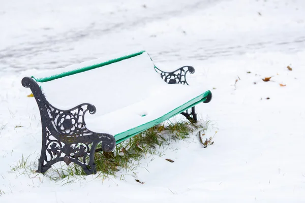 Snow-covered bench