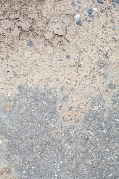 Tekstura brudnej suszonej ziemi i asfaltu — Zdjęcie stockowe