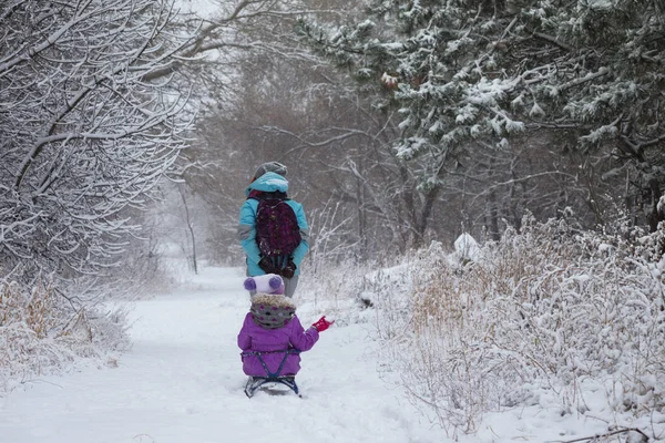 Happy mother and daughter on a winter walk — Stock Photo, Image