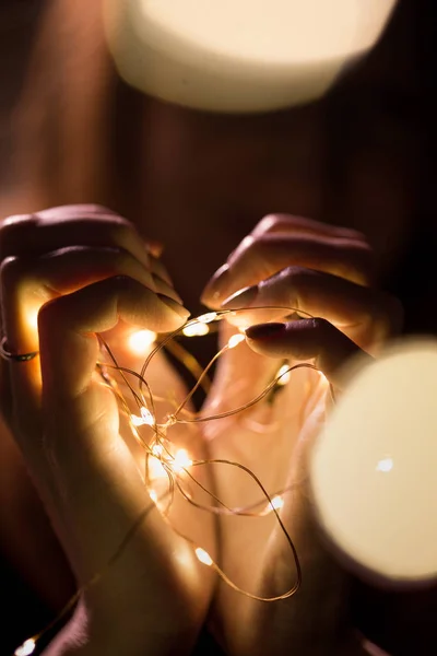 Christmas garland in the hands — Stock Photo, Image