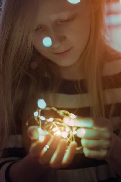 Christmas garland in the hands — Stock Photo, Image