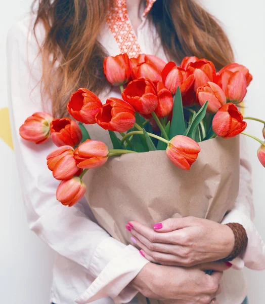 Girl and tulips — Stock Photo, Image