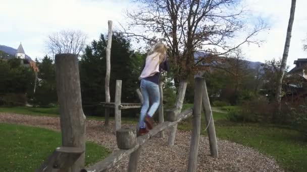 Child Girl Having Fun Wooden Playground Small European Village Sunny — Stock Video