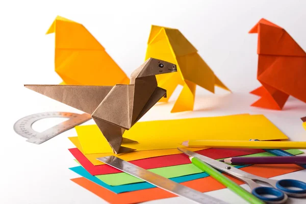 Origami bird made of colored paper — Stockfoto