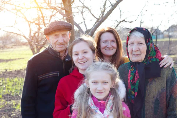 big happy family. portrait of smiling senior man  and granddaughter with  great granddaughter