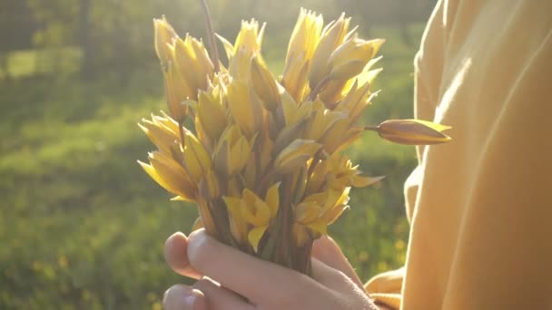 Teen Girl Holding Bouquet Yellow Tulips Standing Green Forest Lawn — Stock Video