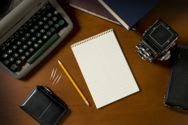 Blank steno notepad on a desk among vintage journalism props — Stock Photo, Image