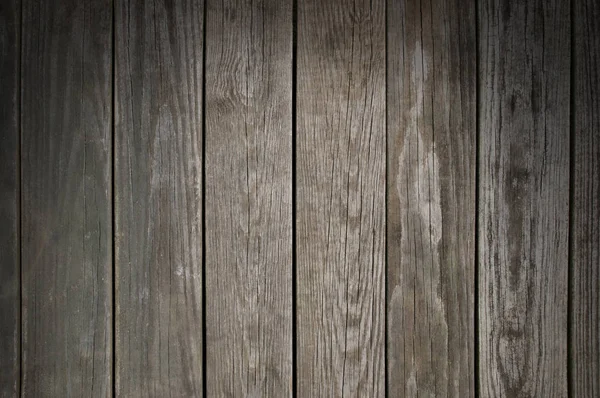 Verweerde houten planking achtergrond verlicht van bovenaf — Stockfoto