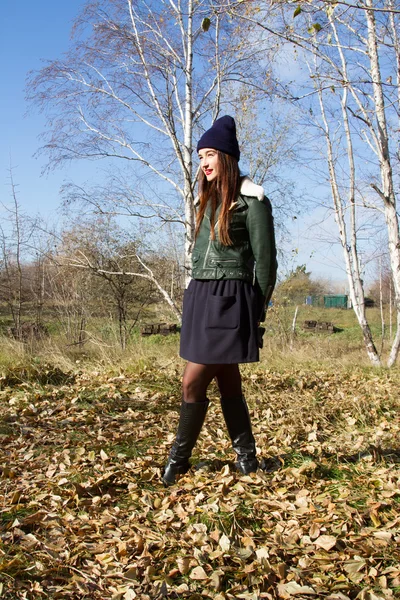 Girl walks in autumn forest — Stock Photo, Image