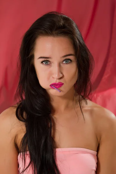 Young girl with lollipop posing on camera — Stock Photo, Image