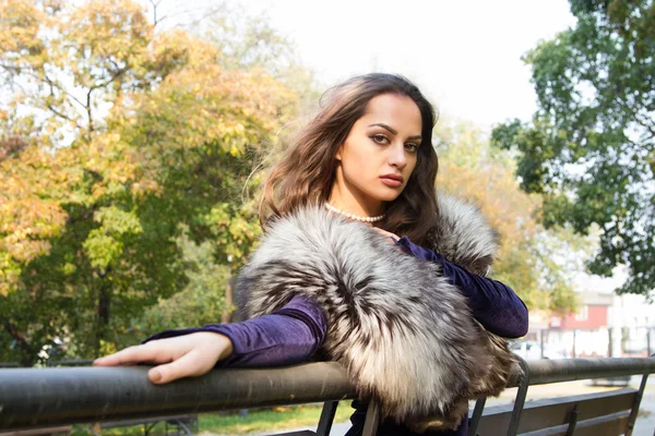 Girl in evening dress walks on autumn park — Stock Photo, Image