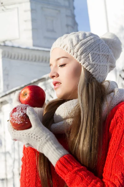 Young girl holds in hands red apples. — Stock Photo, Image