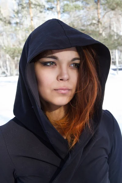 Red-haired young girl in a hood — Stock Photo, Image