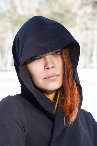 Red-haired young girl in a hood — Stock Photo, Image