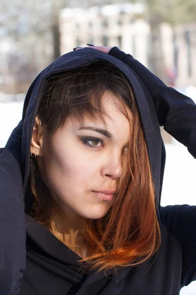 Portrait of red-haired girl in the hood — Stock Photo, Image