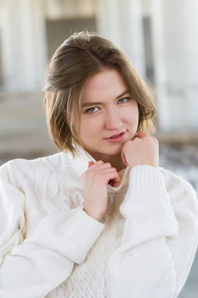 Young girl in a white sweater — Stock Photo, Image