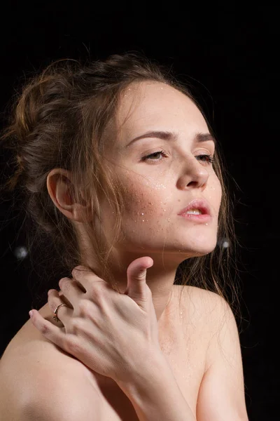 Portrait of an emotional young girl with sparkles on her face — Stock Photo, Image