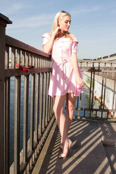 Young blonde on the river embankment — Stock Photo, Image