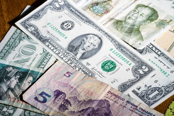 American dollars and Chinese yuan in small denominations — Stock Photo, Image