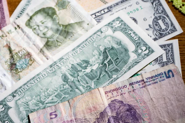 American dollars and Chinese yuan in small denominations — Stock Photo, Image