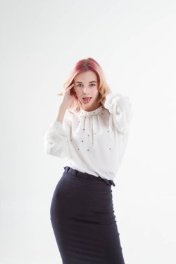 Blonde in a white shirt and dark skirt. Portrait on a white background