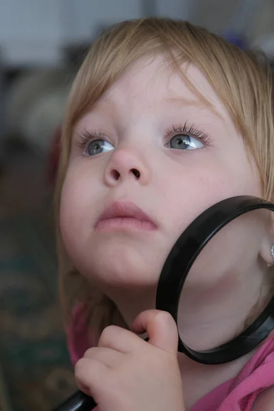 Little Girl Looks Large Magnifier — Stock Photo, Image