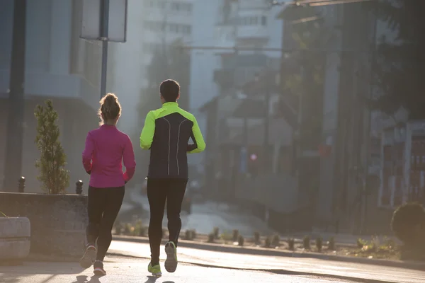 Mladý pár, jogging — Stock fotografie