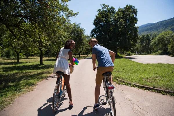 Young  couple having joyful bike ride in nature — Stock Photo, Image