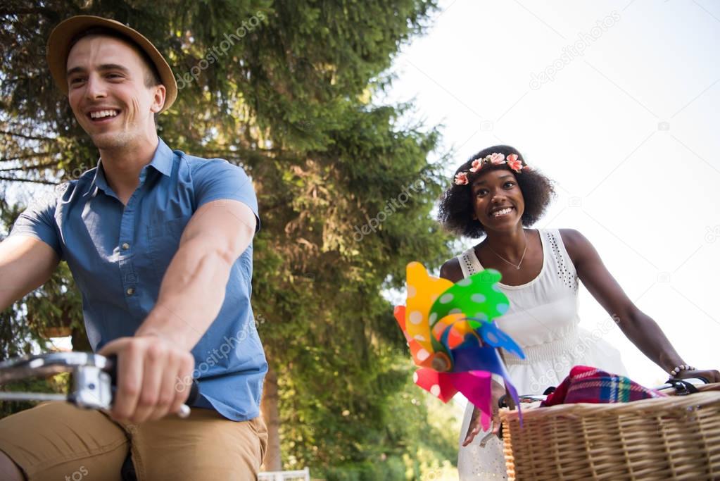 Young  couple having joyful bike ride in nature