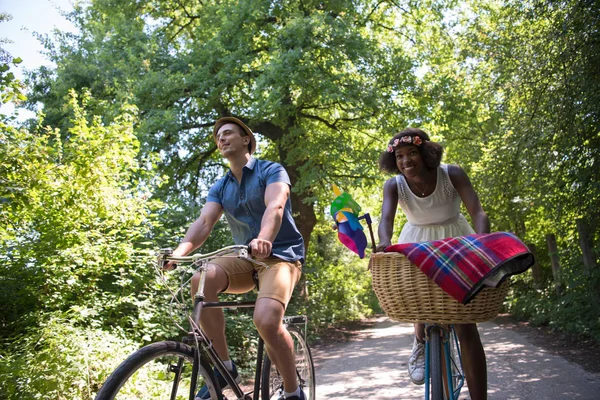 Young  couple having joyful bike ride in nature — Stock Photo, Image