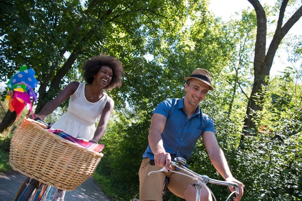 Young  couple having joyful bike ride in nature — Stock Photo, Image