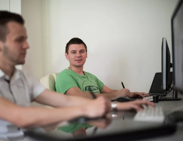 A group of graphic designers at work — Stock Photo, Image