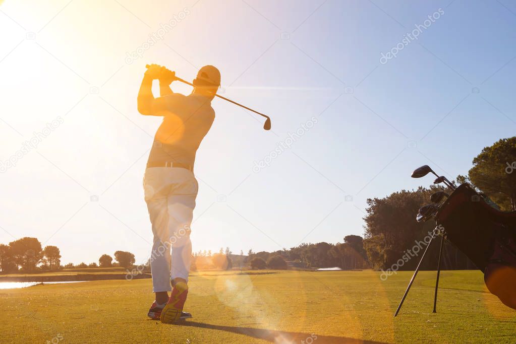 golf player hitting shot with club