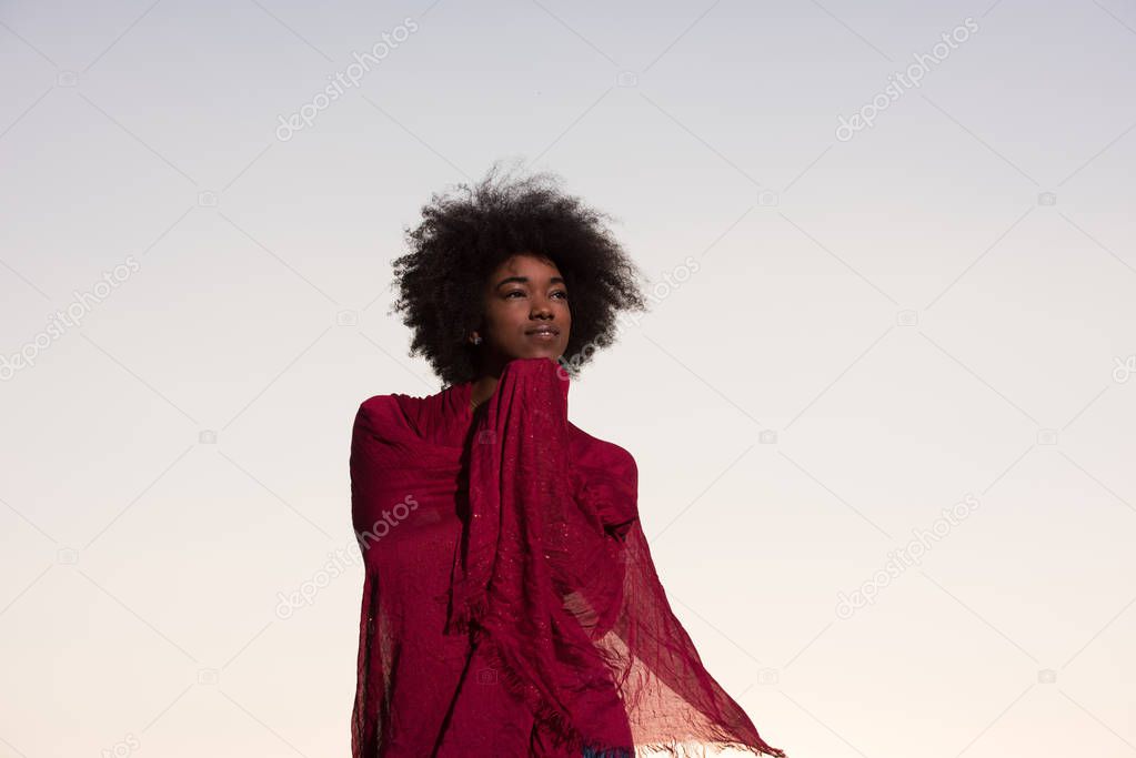 outdoor portrait of a black woman with a scarf