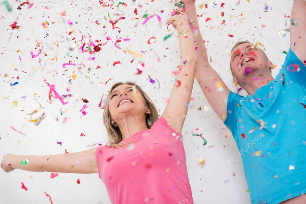 romantic young  couple celebrating  party with confetti