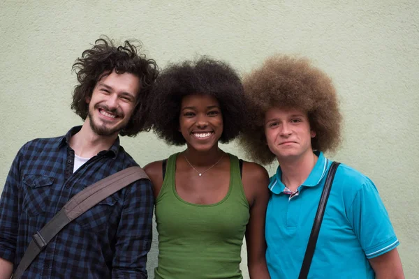 Multiethnic group of happy three friends — Stock Photo, Image