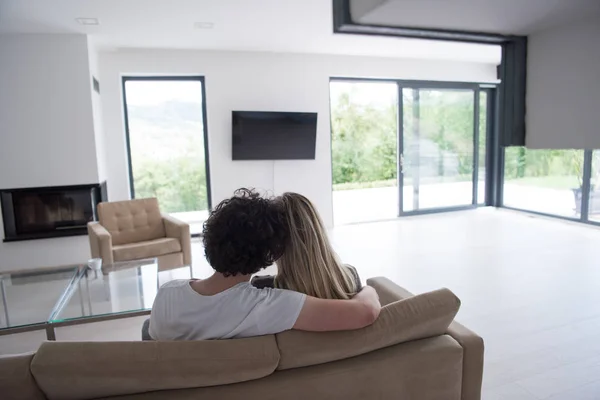 Rear view of couple watching television Stock Image