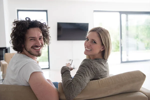 Rear view of couple watching television — Stock Photo, Image