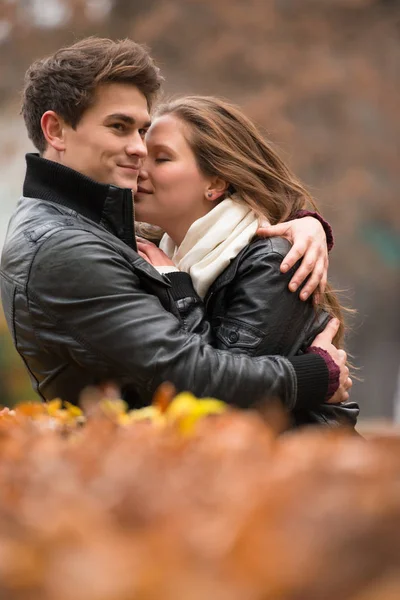 Autumn portrait of attractive happy couple — Stock Photo, Image