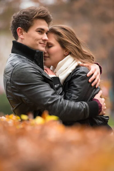 Autumn portrait of attractive happy couple — Stock Photo, Image