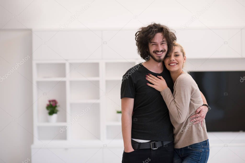 couple hugging in their new home