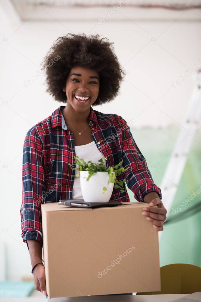 Black girl moving in the new apartment
