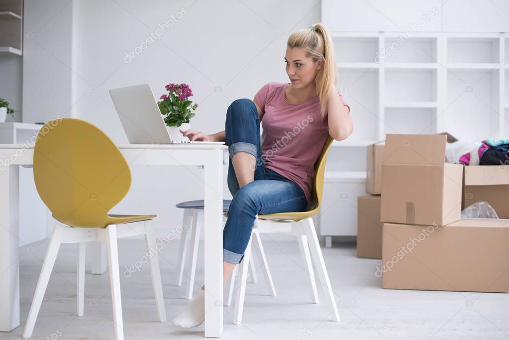 Young woman moving in a new home