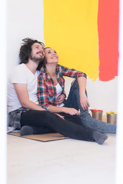 Happy couple relaxing after painting — Stock Photo, Image