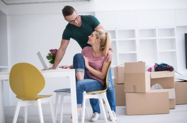 Young couple moving in a new home clipart