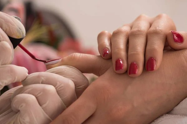 Woman hands receiving a manicure — Stock Photo, Image