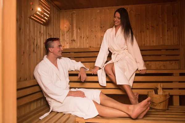 Couple relaxing in the sauna — Stock Photo, Image